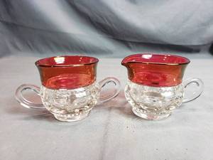 lot 55 image: Tiffan Franciscan Kings Crown Ruby Flash Creamer and Sugar Set