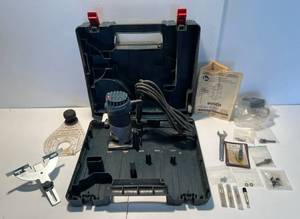 lot 26 image: Bosch Colt 1HP Palm Router With Case, Manual, Some Bits And More