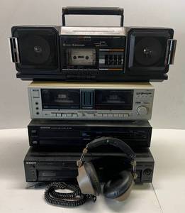 lot 189 image: Large Group Of Misc. Vintage Electronics Including Kenwood CD Player( Non Working) Sony DVD Player (Powers Up) , Metal Cassette Player (Powers Up), Sharp Radio (Works)