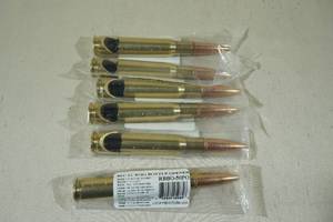 lot 37 image: Lucky Shot 50 Cal BMG Casing Bottle Openers