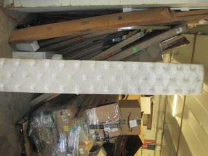 king size end to a bed with other p...