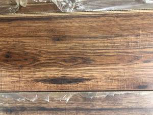 21 Cases of Distressed Brown Hickory 12 mm T x 6.3 in. W Laminate Wood Flooring (15.5 sqftcase) by Home Decorators Collection Customer Returns See Pictures