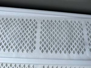 lot 16 image: Large Bin of White Gutter Covers