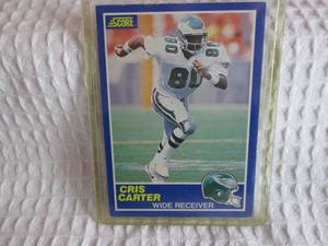 lot 28 image: 1989 Score Cris Carter Rookie Card...