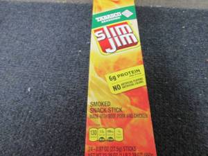 lot 227 image: Box of 24- 0.97 oz Slim Jim Tabasco...