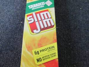 lot 228 image: Box of 24- 0.97 oz Slim Jim Tabasco...