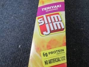 lot 230 image: Box of 24- 0.97 oz Slim Jim Teriyak...