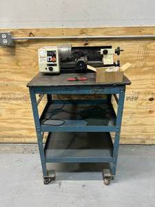 lot 14 image: SHOP FOX M1015 6 X 10 MINI-LATHE with Rolling Cart and Tools