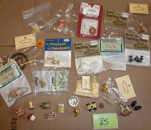 lot 85 image: Group of Doll House miniatures including a toaster, lamps, candles, pitcher, box of raisins, bells, phone