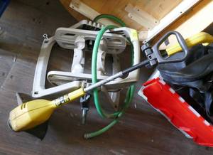 lot 92 image: Garden hose reel and McCulloch electric string trimmer