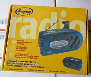 lot 132 image: New Solar powered Radio with Crank for backup power