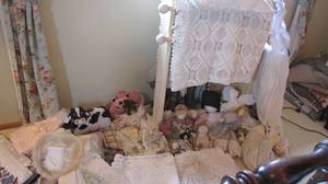 Quilt rack with quilts, handmade dolls and more
