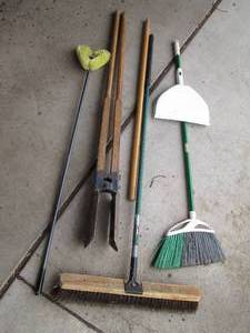 Brooms, post hole digger, brush