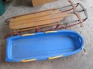 Vintage wood sled and plastic sled