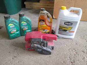 Automotive chemicals and an  electric belt sander