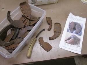 Vintage iron ox shoes and tools