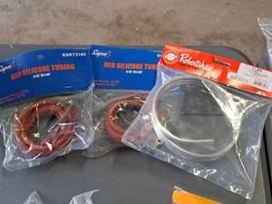 lot 63 image: Supco Red Silicon Tubing 316IDx60 (x2), Robert Shaw Aluminum Tubing with Fittings 14x5 11-293 (in original packaging)