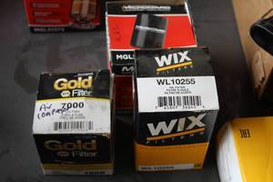 lot 522 image: Lot of (3) Oil Filters - NAPA Gold 7000, Wix WL10255, MicroGard MGL