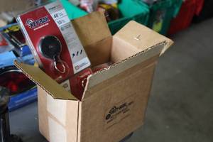 lot 540 image: Lot of (9) Key-Bak Key Holders (in original packaging)