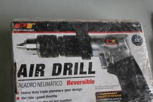 lot 553 image: Performance Tool 12 Air Drill (in box)