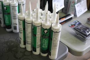 lot 556 image: Lot of (12) Red Devil Industrial Butyl Rubber Sealant
