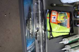 lot 558 image: Windshield Wiper Blades (x3), Safety Vests (x2)