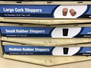 3 BIN CABINET WITH ASSORTED STOPPERS