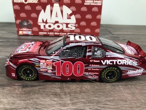 lot 12 image: 2002 Team Caliber Mac Tools Hendricks Motor Sports 100 victories 124 scale die cast stock car