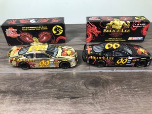 lot 98 image: 1999 Nascar Racing Champions Jeff Burton Ford Taurus #99  Bruce Lee 2 car set 124 scale die cast stock cars