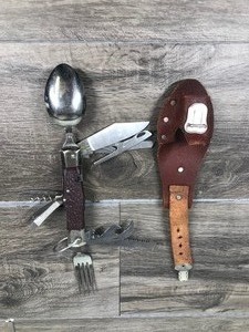 lot 135 image: Multi Tool Use MacGyver Fold Up Stainless Knife Spoon Can Opener Screw Driver File Cork Screw & More.