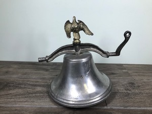 lot 399 image: Large metal bell with eagle on top