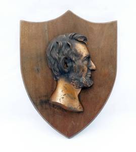 lot 1 image: Antique Bronze Cast Abraham Lincoln Profile Wall Plaque On Wood by DL Hallett