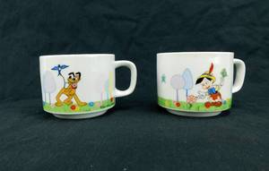 lot 16 image: Vintage 1970s Walt Disney Productions Pluto and Pinocchio Stacking Mugs