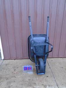 True Temper commercial wheel barrow. Well used. Needs tube. As shown.
