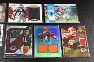 lot 212 image: Mixed Years Football Relic Lot  9 Relic Cards
