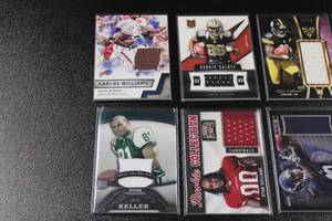 lot 214 image: Mixed Years Football Relic Lot  8 Relic Cards