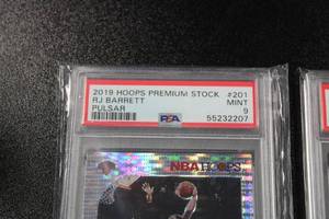 lot 271 image: 2019-20 Hoops Premium Stock Pulsar Prizm RJ Barrett #201 & Coby White #295 PSA 9