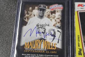 lot 273 image: Maury Wills In Person Autograph 97-98 Fleer Million Dollar Moments & 1982 Kmart Topps #2