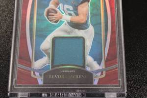 lot 317 image: 2021 Select Red Prizm Trevor Lawrence Jersey #RSW-TLR Rookie Card