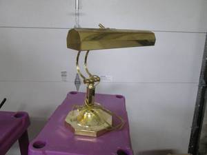 Brass tone adjustable desk lamp.