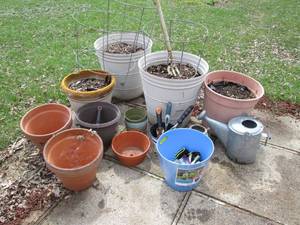 outdoor planters, watering cans and gardening tools