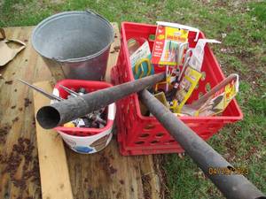 Milk crate filled with an assortment of items