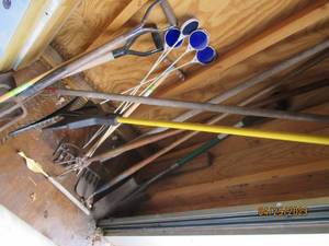 Nice variety of outdoor rakes, shovels, etc