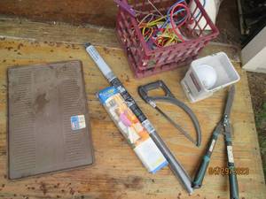Plastic milk crate full of assorted items
