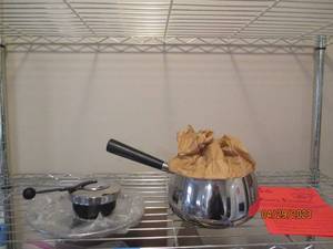Stainless steel fondue pot.