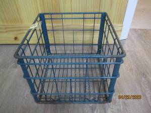 Vintage colored metal milk crate.