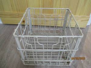 Vintage colored metal milk crate.