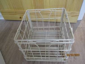 Vintage colored metal milk crate.