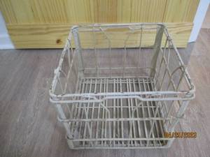 Vintage colored metal milk crate.
