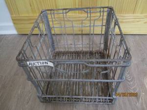 Vintage colored metal milk crate.